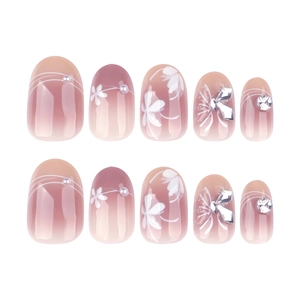 Pink gradient press-on nails with white flower patterns, pearls and rhinestone accents