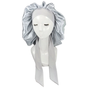 Detailed view of silver satin sleep bonnet with adjustable ribbon ties and elastic edge