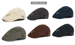 Detail of vintage flat caps in six colors with metal Sports badge and adjustable buckles
