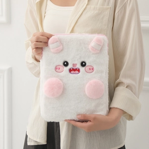 Detail of soft white plush tablet case with cute cartoon monster features and pink zipper