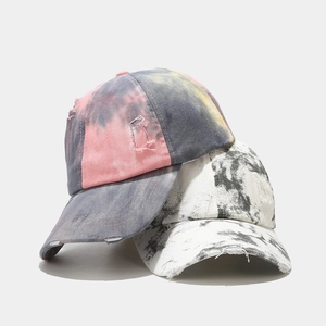 Tie-dye distressed baseball cap with vintage ripped details for street fashion style