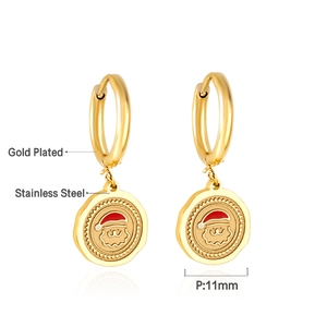 Detail of 11mm gold plated stainless steel earrings with Santa Claus pattern engraving