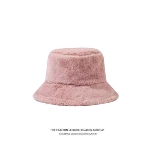 Close-up of soft pink faux rabbit fur texture on a thick winter bucket hat