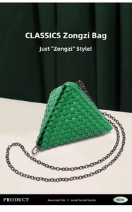 Close-up of green woven leather triangle mini bag with dark grey metal chain strap
