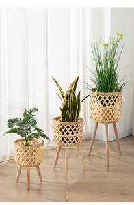 Three-tier woven bamboo plant stands with solid wood legs for indoor greenery decor