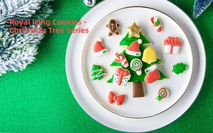 Detailed view of assorted Christmas icing cookies including tree and gingerbread man on a plate
