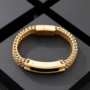 Close-up of gold stainless steel woven wheat chain bracelet with polished metal plate