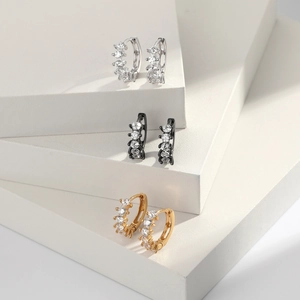 Detailed macro view of S925 sterling silver hoop earrings with white zircon inlays
