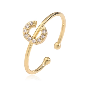 Detailed view of a gold-plated letter C open ring with sparkling cubic zirconia inlay