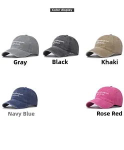 Detail view of cotton baseball caps in five colors with 'Champagne please' embroidery