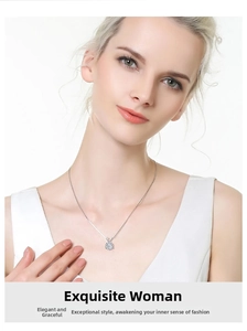 Close-up of a classic silver necklace with a six-prong Moissanite pendant worn by a model