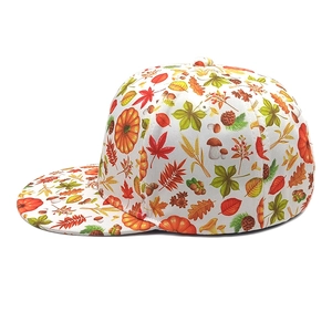 Detail of harvest-themed flat brim cap with maple leaf, mushroom and pumpkin prints