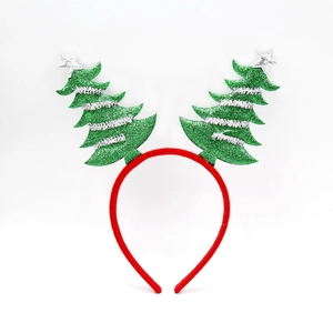 Close-up of festive headband with green glittery Christmas trees and silver star details