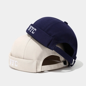 Classic cotton NYC embroidered docker hats in navy and beige with adjustable straps