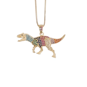 Hip hop dinosaur pendant necklace in gold finish with colorful zircon stones on white background