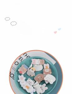 Detailed view of cute acrylic animal badges featuring bear and rabbit for bag decoration