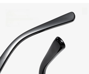 Close-up of sleek black curved sunglasses legs with a glossy finish and smooth lines