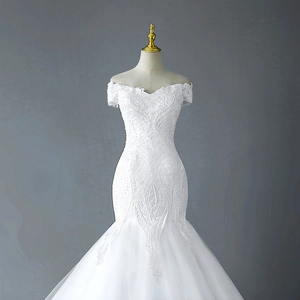Elegant white mermaid bridal gown with short sleeves and intricate lace beaded embroidery
