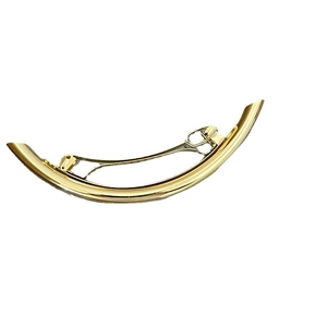 Elegant gold metal curved hair claw clip with a polished finish on white background