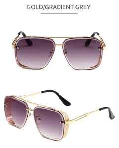Close-up of steampunk square sunglasses featuring a gold metal frame and gradient grey lens