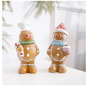 Close-up of resin gingerbread man figurines with frosted texture and festive details