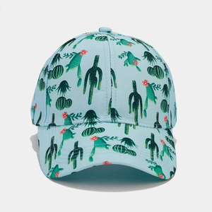Detailed view of the tropical cactus print on this light blue breathable cotton baseball cap