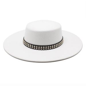 Detail of white wool fedora hat featuring black band with silver metal square rivets