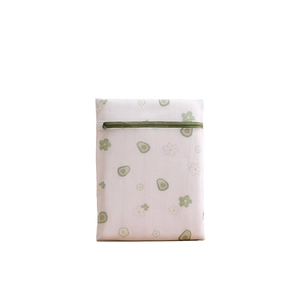 Thick mesh laundry bag with green zipper and avocado print for machine washing