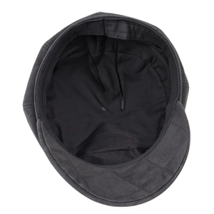 Detailed interior of black faux suede newsboy cap showing soft lining and sweatband