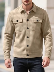 Detail of khaki waffle knit fabric texture on men's shirt jacket with chest pockets