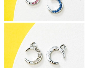 Detailed view of colorful rhinestone moon pendants in pink blue and clear crystals