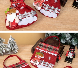 Detailed close-up of Christmas gift bag with 3D Santa and snowman felt appliques