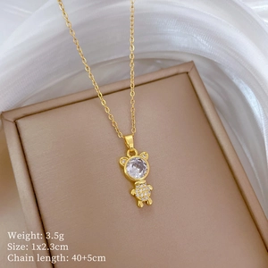 Detailed close-up of a sparkling gold bear pendant with full zircon inlay and dimensions