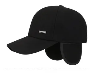 Detail showing the thick wool fabric texture and the SPORT metal logo on the earflap cap
