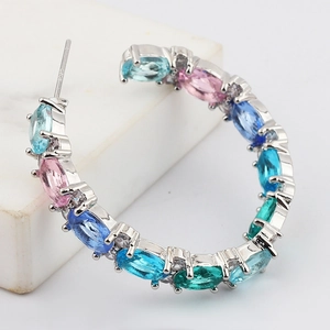 Macro view of S925 sterling silver earrings with multi-color marquise-cut zircons