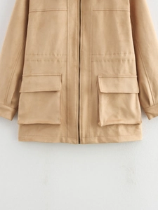 Detail of faux suede long jacket featuring metal zipper and large flap utility pockets