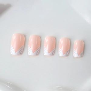 Classic white French press-on nails with butterfly floral patterns on nude pink base