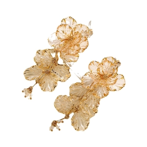 Elegant gold flower tassel earrings with clear resin petals and metallic core details