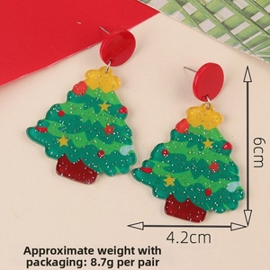 Detail of green acrylic Christmas tree earrings with glitter and 6cm size markings