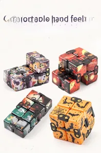 Detailed close-up of Halloween themed infinity cubes with pumpkins and ghost patterns