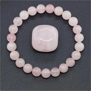 Pink crystal beaded elastic bracelet with a large central square rose quartz stone