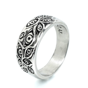 Silver 925 sterling steel ring with engraved Evil Eye patterns on white background