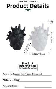 Detail view of resin heart-shaped vase in black and white with 15cm height dimensions