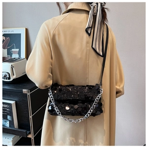 Chic black sequin crossbody bag featuring a thick silver chain strap and shiny texture