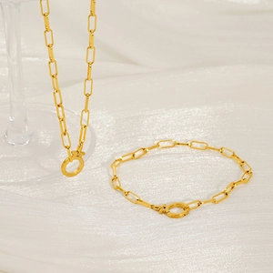Detail of 18K gold-plated paperclip chain necklace with a Venus symbol charm clasp