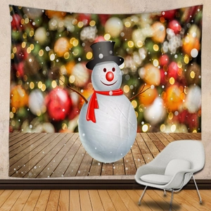 Detail of Christmas snowman tapestry background cloth with warm bokeh festive lights