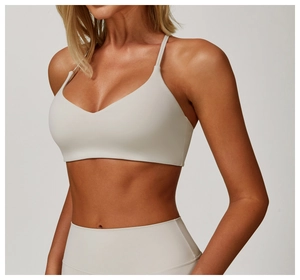 Close-up of light grey brushed yoga bra and high waist leggings on female model