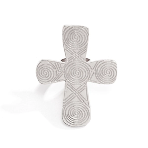 Detail of silver metal cross ring with intricate swirl engravings and geometric patterns