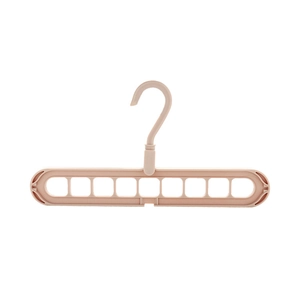 Space-saving 9-hole magic clothes hanger in light pink plastic for closet organization
