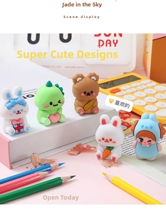 Set of five cute cartoon resin figurines including a rabbit, bear, and dinosaur on a desk